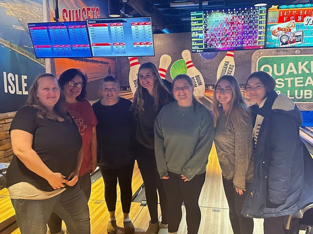 The Little Acorns teaching team enjoying a bowling night out